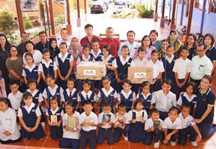 Naim contributes new computers, reading materials to SK St Phillip