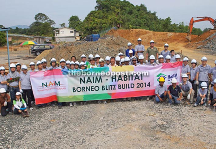 Naim lends muscle to Habitat for humanity